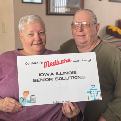 senior couple holding medicare sign