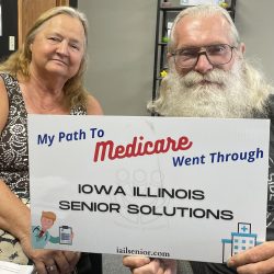 couple holding medicare sign